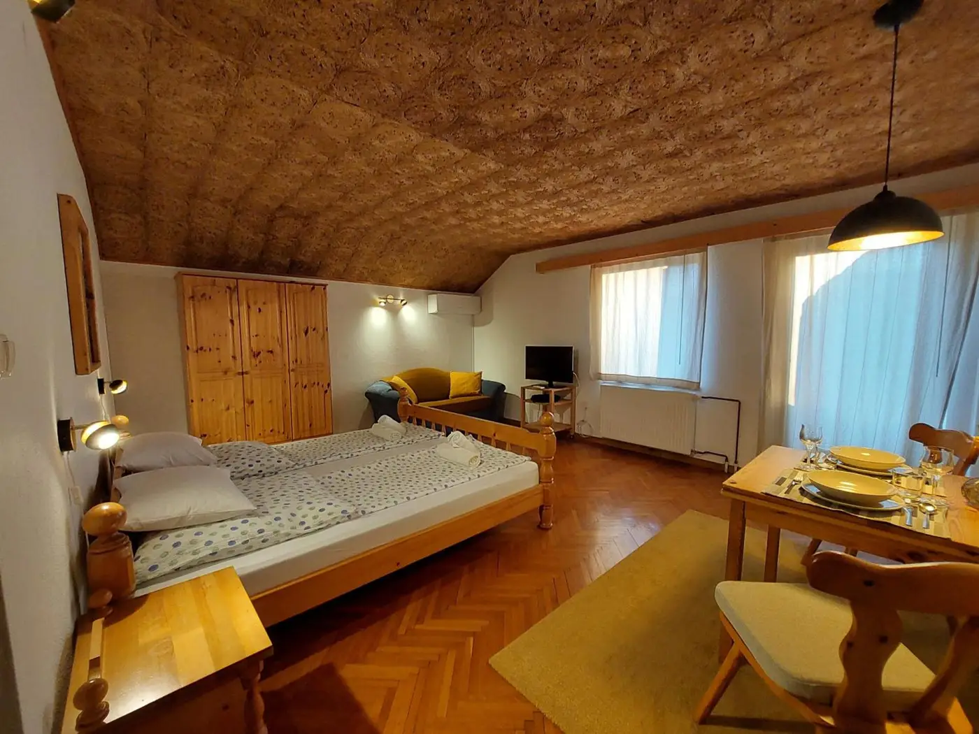 Bedroom and living area of The Julian Alps