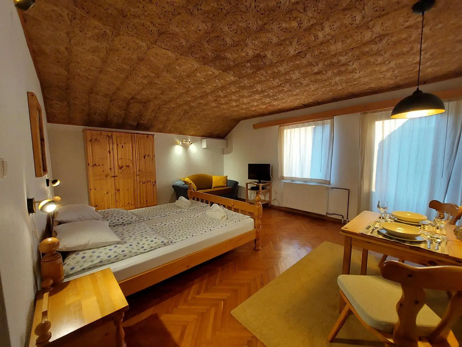 Bedroom and living area of The Julian Alps