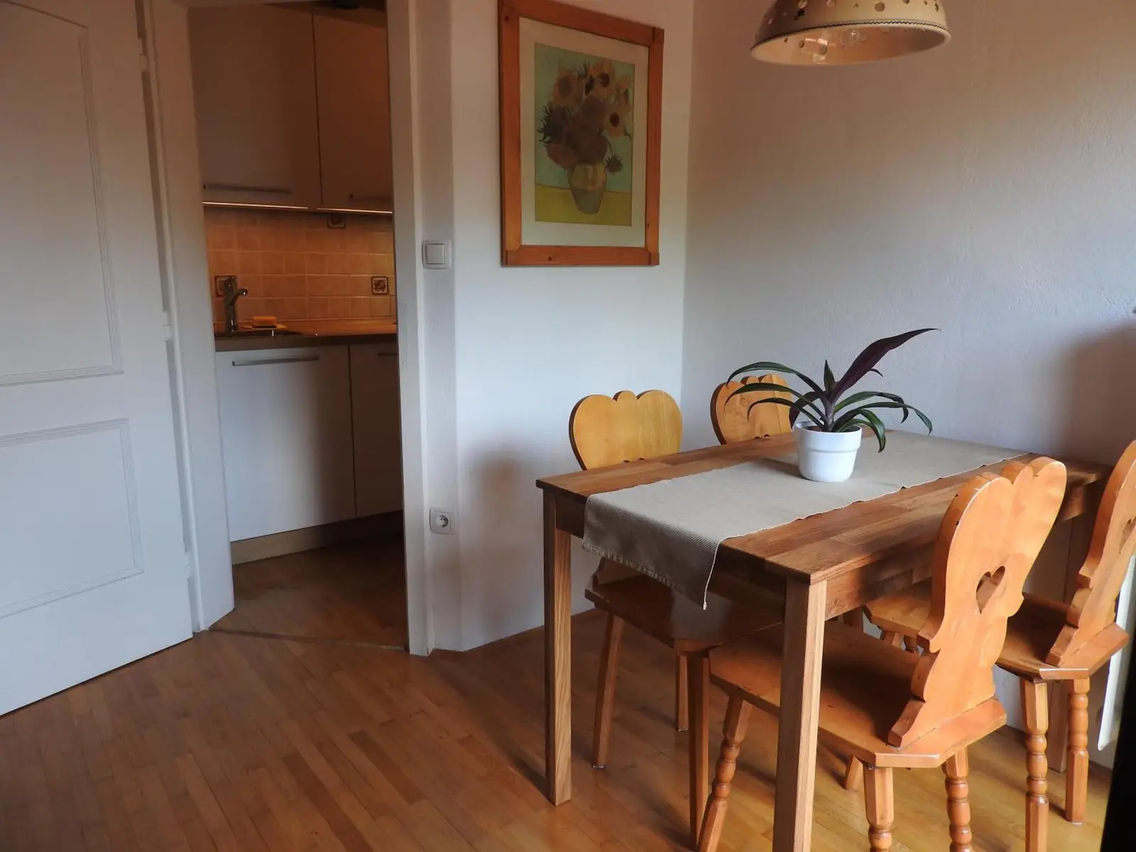 Living and dining area of The Karavanks with the balcony doors open