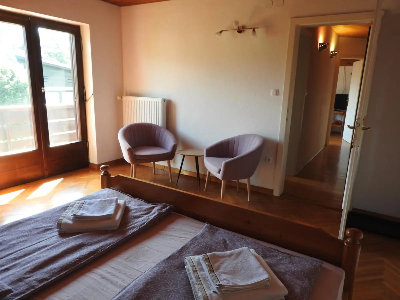 Bedroom of The Karavanks with two armchairs by the window